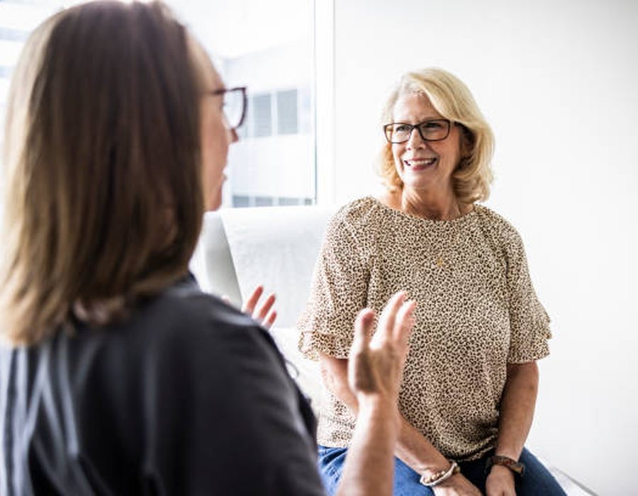 A clinician listening carefully during a consultation